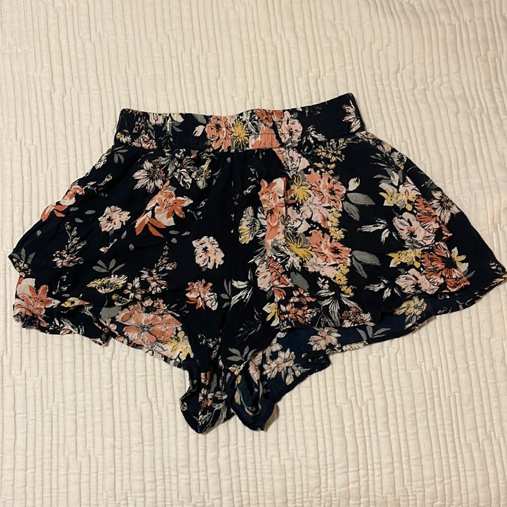 Black shorts with light pink flowers